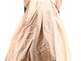 the back of a woman ' s dress with a long train