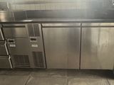 a kitchen with a stainless steel refrigerator and a dishwasher