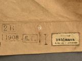 a brown paper bag with a sticker on it