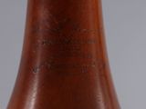 a close up of a brown vase with writing on it