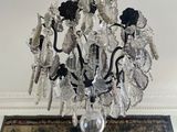 a crystal chandelier hanging from a ceiling in a room
