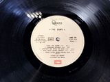an old record with a label on it sitting on top of a table