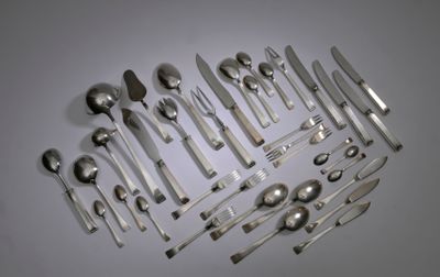 a lot of silver spoons and spoon spoons on the table