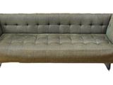 an image of a couch that is sitting on a white background