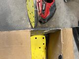 a box with a pair of yellow skateboards inside of it