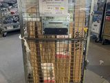 a cart with a lot of items in it in a warehouse