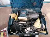 a blue tool box with tools in it on the floor