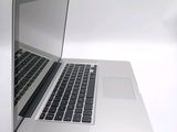 a close up of a laptop computer on a white surface