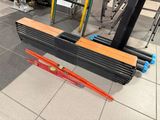 a pile of skis and ski poles on the floor