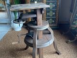 a wooden table with a potted plant on top of it