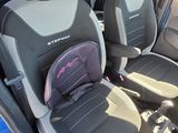 a baby seat in the back of a blue car