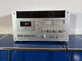 the radio is sitting on top of the blue counter