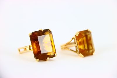pair of yellow gold and citrine earrings on a white background