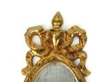 a gold frame with a picture of a woman in it