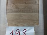 a piece of wood with a price tag on it
