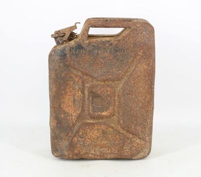 an old rusty metal jerry canister with a spout on the side