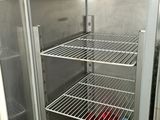 a refrigerator with a lot of bottles inside of it