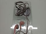 a pair of ear buds in a clear box