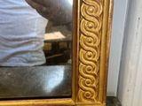 a man taking a picture of himself in a mirror