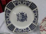 a blue and white plate with a picture of a castle on it