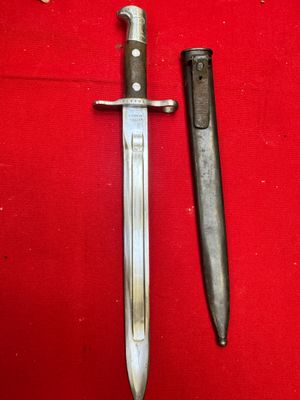 a knife and a knife holder on a red cloth