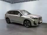 the new bmw x1 suv is parked in a showroom