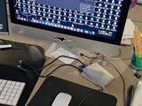 a desk with a computer and a keyboard on it
