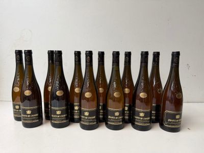six bottles of wine lined up in a row on a table