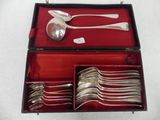 silverware in a red case on a white table cloth