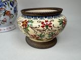two vases sitting next to each other on a table