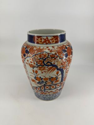 a vase that is sitting on a white surface