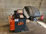 a small machine that is sitting in a garage