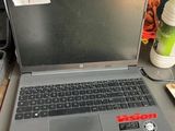 a laptop computer sitting on top of a desk