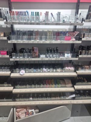 a large display of cosmetics products in a store