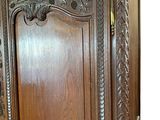 a large wooden cabinet with carvings on it