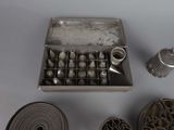 a metal box with a lot of different items in it