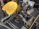 many old cars in a garage with a smiley face on the front