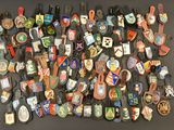 many different types of badges on a black surface