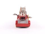 a red toy fire truck with a ladder on it