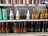 many bottles of different types of hair products on the shelves