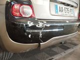 a car that has been damaged and is parked in a garage
