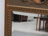 a mirror that has a picture of a woman on it