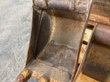 a close up of a bulldozer on a wooden pallet
