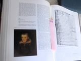 an open book with a picture of a child on it