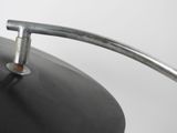a black pan with a handle on a white table