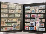 a black book with stamps on it and a picture of a man