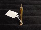 a small metal object with a tag on it