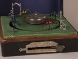 a small toy that is in a suitcase on a table