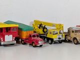 a lot of toy trucks lined up together on a white surface