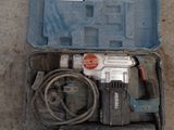 a box with a drill and a cord in it